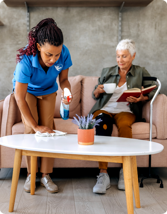 A Visiting Angels caregiver and an elderly woman engaging in a thoughtful conversation, illustrating support and connection for individuals with Alzheimer's.