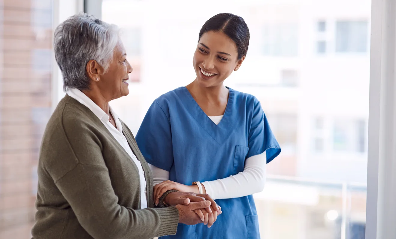 HHA caregiver arm and arm with client