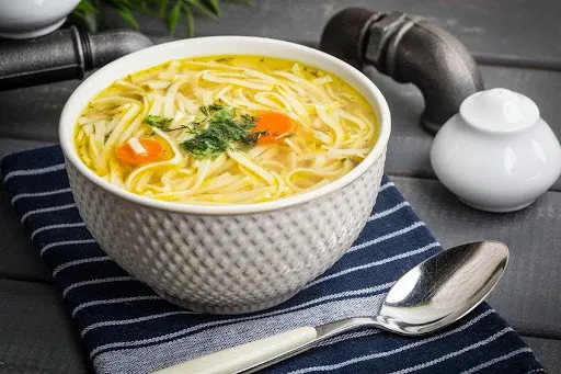 A bowl full of soup.
