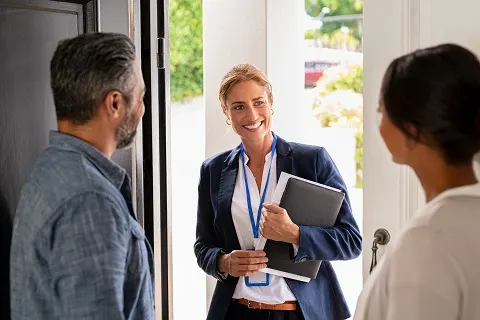 couple talking to home care provider